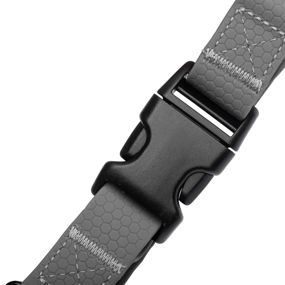 Secure side-release buckles on black waterproof dog harness for easy fit