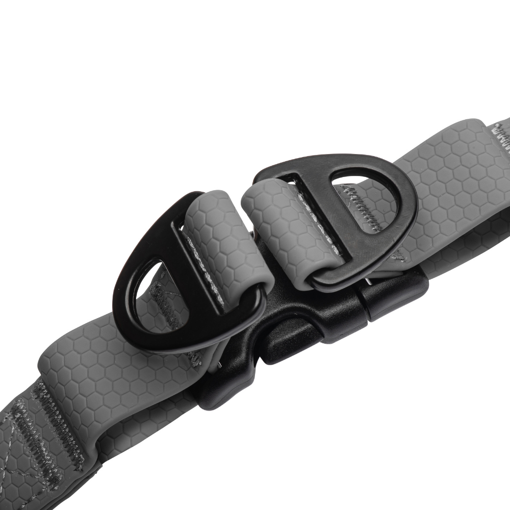 Close-up of heavy-duty D-rings on black waterproof dog harness