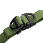 Close-up of heavy-duty D-rings on green waterproof dog harness